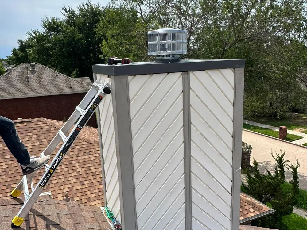 New chimney chase cover and cap fitted on a rooftop