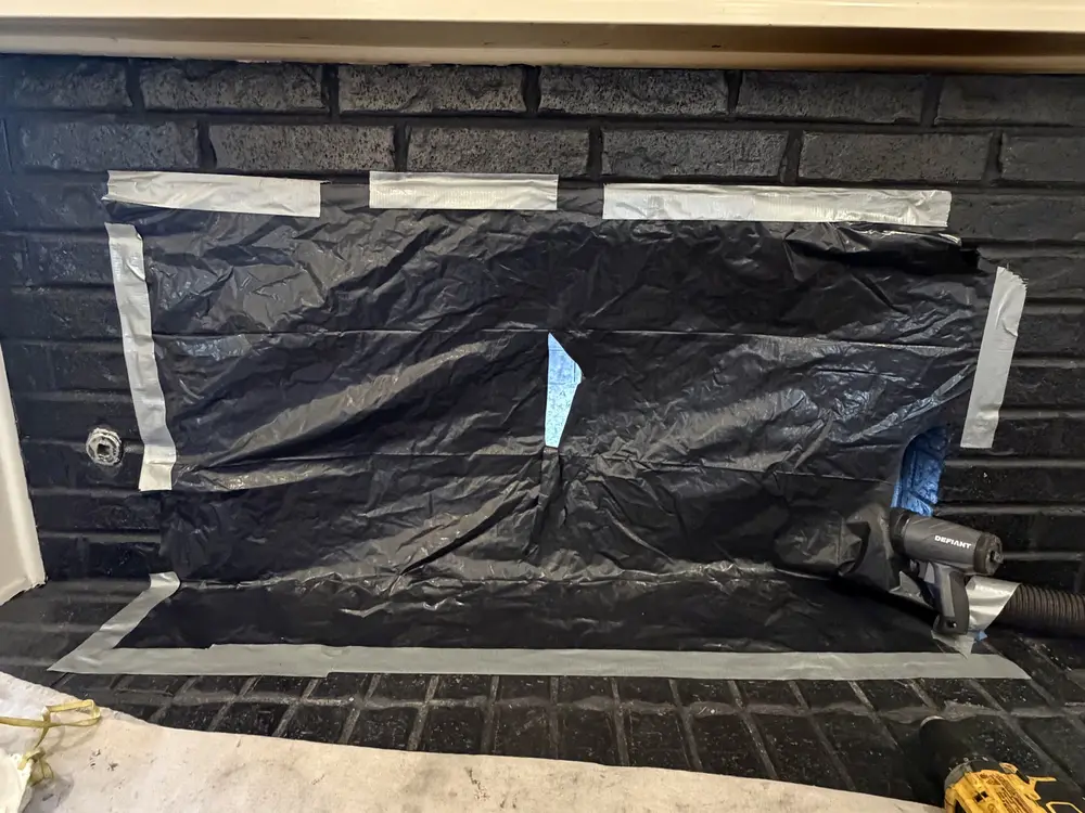 Fireplace sealed in protective containment before a sweep