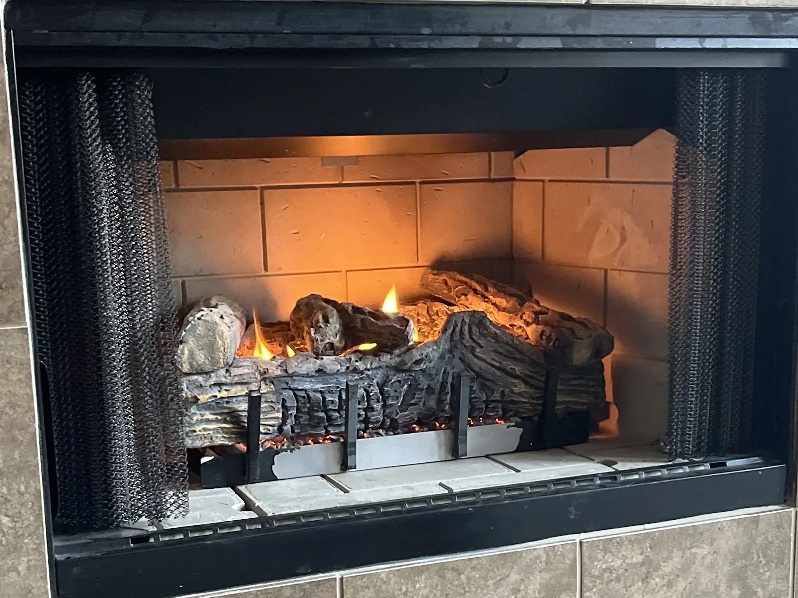 Audrey Keech's fireplace burning again after its repair — her photo from her Google review
